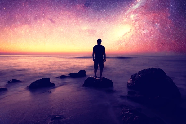 A psychic medium peacefully dreaming, surrounded by spiritual symbols and glowing light, illustrating the connection between dreams and psychic abilities